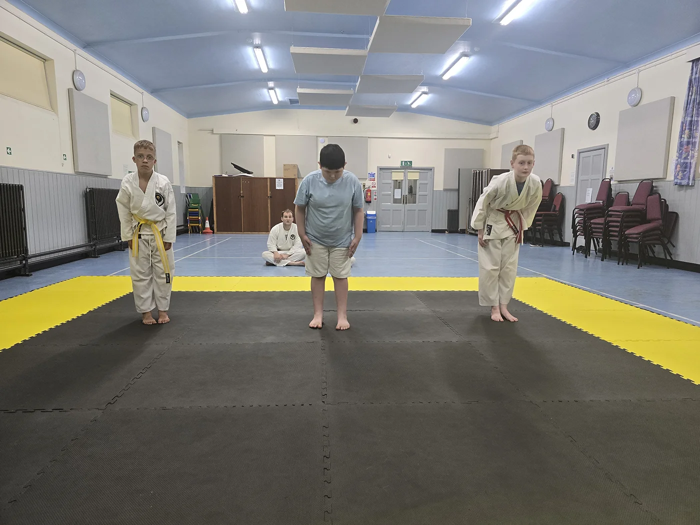 Young karate students bowing during training at St Martins Karate Carnforth
