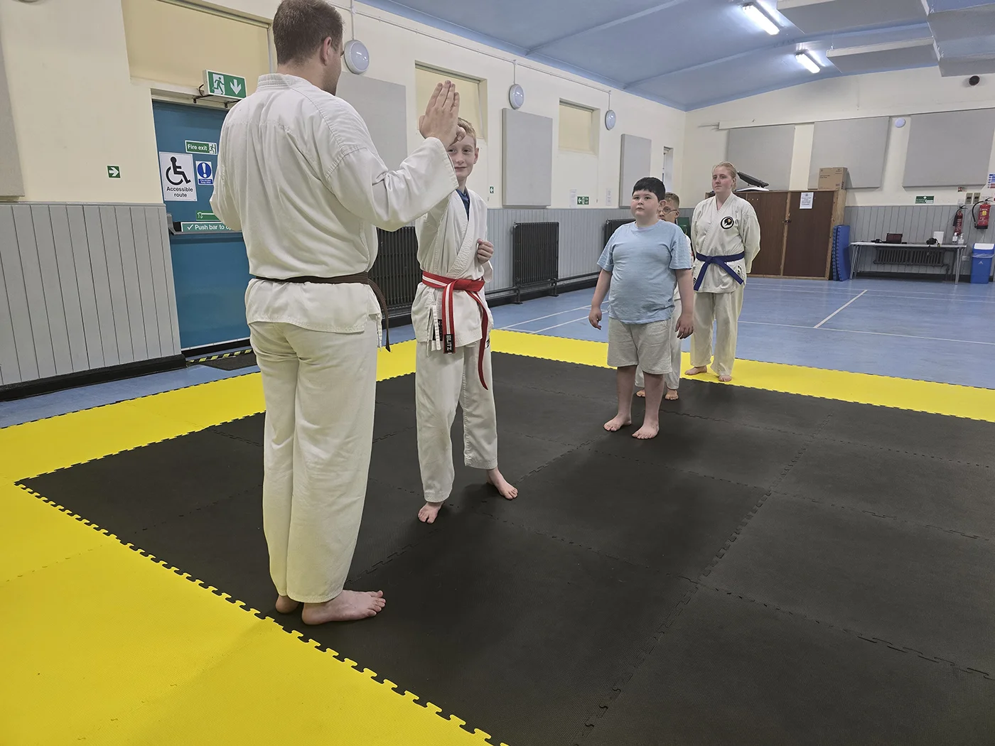 Karate students practising partner training during a class at St Martins Karate Carnforth